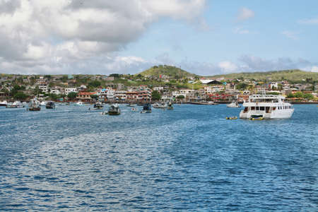 GALAPAGOS, ECUADOR - APRIL 29: Views of boats and houses arriving at colorful Puerto Baquerizo Moreno in San Cristobal island. Puerto Baquerizo is one of only 2 inhabited port cities in Galapagos island.のeditorial素材