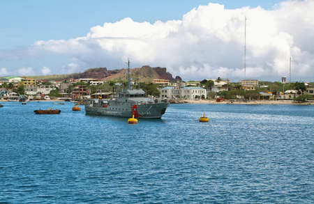 GALAPAGOS, ECUADOR - APRIL 29: Views of coastguard vessel and houses arriving at colorful Puerto...