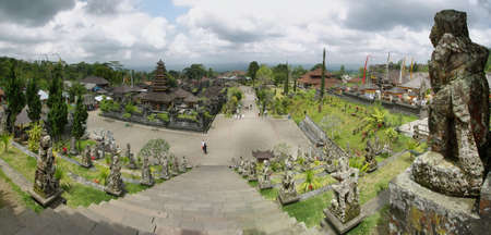 BALI, INDONESIA - SEPTEMBER 30: hinduism scattering people taking offerings on September 30, 2009 in Besakih temple. This temple is known as the mother temple and is the largest and most important in Bali, Indonesia.のeditorial素材