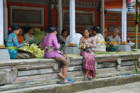 BALI, INDONESIA - SEPTEMBER 30: hinduism women making offerings for the gods on September 30, 2009...