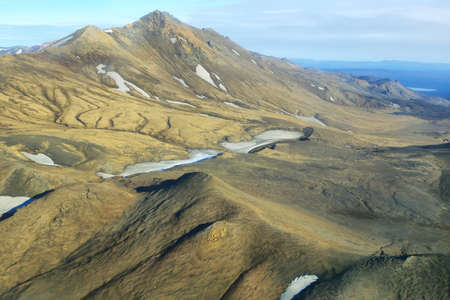 Aerial view of golden mountains in Iceland Highland regionの写真素材