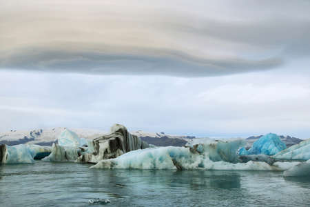 Jokulsarlon Glacial Lagoon of Vatnajokull glacier under majestic lenticular clouds, Iceland