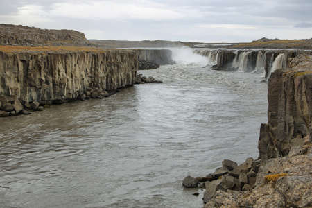 Selfoss waterfall in Iceland. Detifoss is the fastest-flowing and most powerful waterfall in Europe.