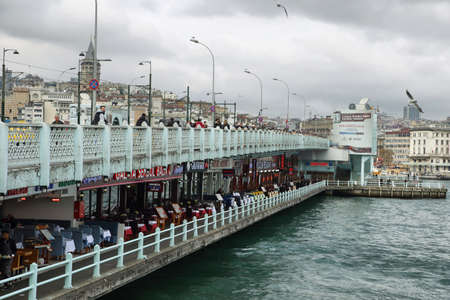 ISTANBUL, TURKEY - NOVEMBER 27: Fishermen and tourists are on November 27, 2014 in Galata bridge, Istanbul. The Galata Bridge is one of the main attractions of Istanbul.のeditorial素材