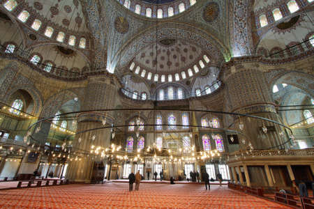 ISTANBUL, TURKEY - NOVEMBER 27: People walking inside of Sultan Ahmed Mosque known as Blue Mosque on November 27, 2014 in Istanbul, Turkey.のeditorial素材