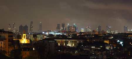 ISTANBUL, TURKEY - NOVEMBER 27:  Istanbul skyline of business buildings at night on November 27, 2014 in Istanbul, Turkeyの写真素材