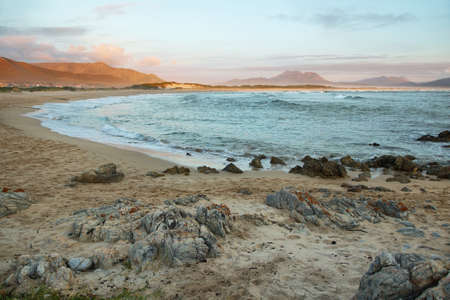 Sunset in idyllic beach of Kleinmond, South Africa
