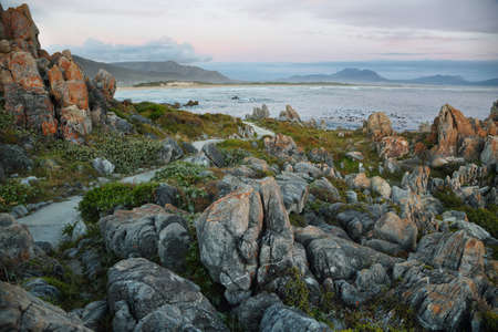 Sunset in idyllic beach of Kleinmond, South Africaの写真素材