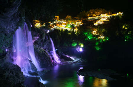 Furong (Hibiscus) ancient village and its waterfall at night, Hunan province, China.の写真素材