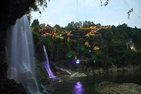 Furong (Hibiscus) ancient village and its waterfall at night, Hunan province, China.の写真素材