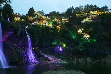 Furong (Hibiscus) ancient village and its waterfall at night, Hunan province, China.の写真素材