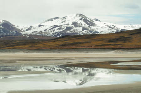 View of mountains and "Aguas calientes"  or "Piedras rojas" salt Lake in Sico Pass, Chileの写真素材