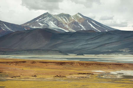 View of mountains and Aguas calientes  or Piedras rojas salt Lake in Sico Pass, Chile