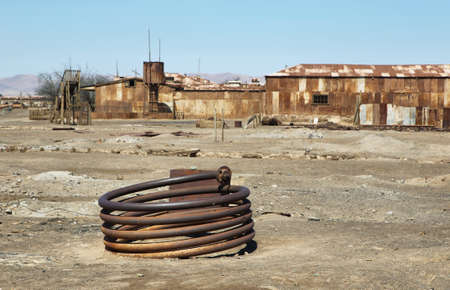 Derelict and rusting coil at the historic Humberstone Saltpeter Works in the Atacama Desert near...