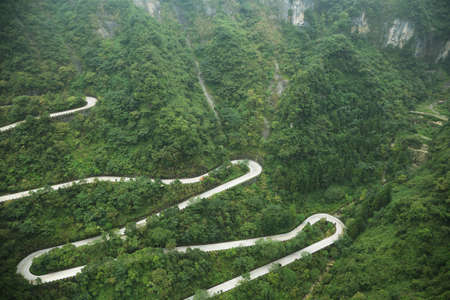 View of winding road of Tianmen mountain national park, Hunan province, Chinaの写真素材