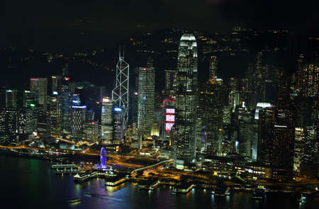 HONG KONG, CHINA - SEPTEMBER 23, 2015: Skyline of the skyscrapers illuminated at sunset from 100 floor of ICC building in Hong Kong.のeditorial素材