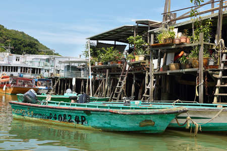 HONG KONG, CHINA - SEPTEMBER 25, 2015: small houses and boats in Tai O fishing village on the western side of Lantau Island, Hong Kongのeditorial素材