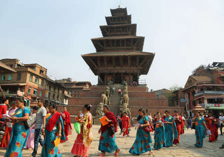 BHAKTAPUR, NEPAL - APRIL 20, 2016: devoted people in a parade in front of Nyatapola Pagoda in taumadhi Square, Bhaktapur, Nepal.のeditorial素材