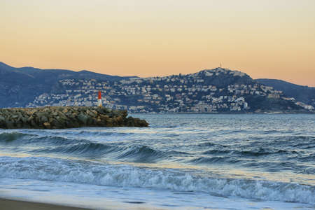 Sunset landscape with a lighthouse in Empuriabrava - popular tourist destination in Spainの写真素材