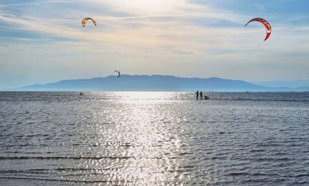 Unidentified people practising kite surf in Ebro Delta at sunset, Spainのeditorial素材