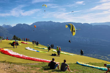 Annecy, France - June 16, 2019: View of people doing paragliding from Col du Forclaz in Franceのeditorial素材