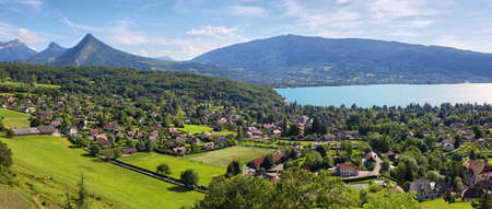 Scenic view of mountains and scattering houses from Menthon castle in Haute-Savoie, Franceの写真素材
