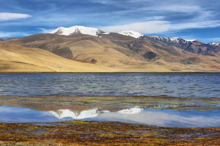Reflection of Tso Moriri lake (Mountain lake) in Ladakh, northern region of India with Tibetan cultureの写真素材