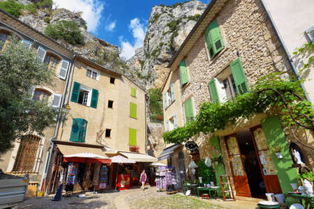 Moustiers Sainte Marie, France - Jul 4, 2019: Tourists in the narrow street of the medieval village Moustiers Sainte Marie. Village is included in list of "The most beautiful villages of France"のeditorial素材