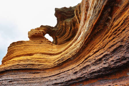 The Yellow Mountain on the ocean shore in Costa del Silencio, Tenerife, Canary islands, Spainの写真素材