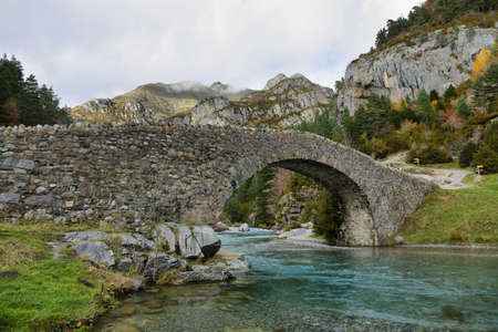 Stone bridge in Bujaruelo valley close to Ordesa and Monte Perdido National Park, Huesca province, Spainの写真素材