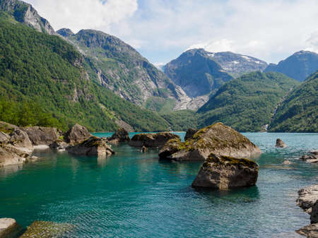 Bondhus mountain lake in Norway. Bondhusbreen glacier tongue is the mountains at background