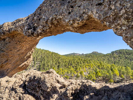 Nublo Window arch (Ventana de Nublo) and forest surroundings, Grand Canary island, Canary islands,...