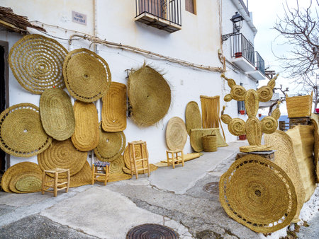 Pampaneira, Spain - February 24, 2023: wicker basket wall in the streets in Pampaneira village, Andalusia, Spainのeditorial素材