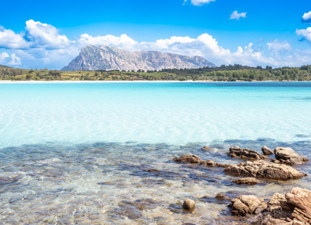 Girgolu beach and Tavolara island in background, Sardinia island, Italyの写真素材