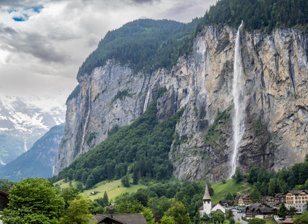 View of mountain peaks and valley between Grimmelwald and Lauterbrunen from Wengen, Switzerlandの写真素材