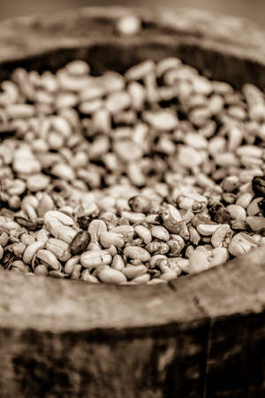dried coffee beans in a tree bowl