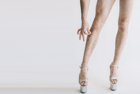 Hairy legs in  heels in  isolated on white background