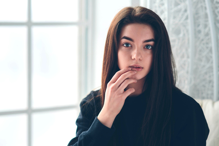 Beautiful girl with dark hair.の写真素材