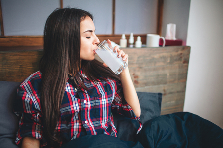 Woman taking medication.の写真素材