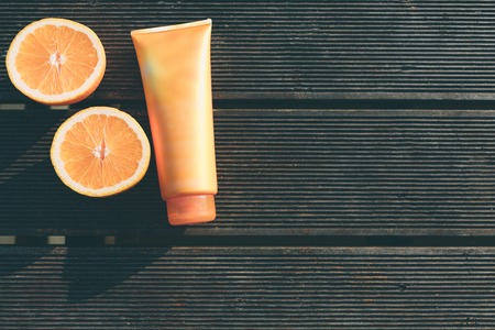 Handsome young man lying in a hammock at a sunny beach by an oceanの写真素材