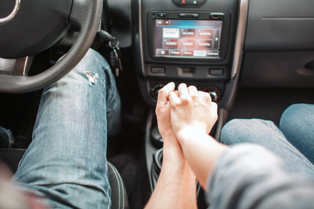 A picture of hands of couple holding each other. Girls hand is on boys. They are keeping it together. It is nice and lovely.の写真素材
