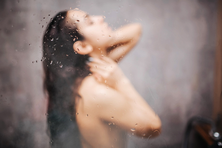 Young attractive sexy woman in shower.の写真素材