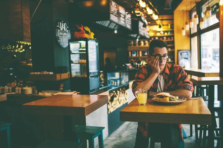 Man has no appetite in the restaurant.の写真素材