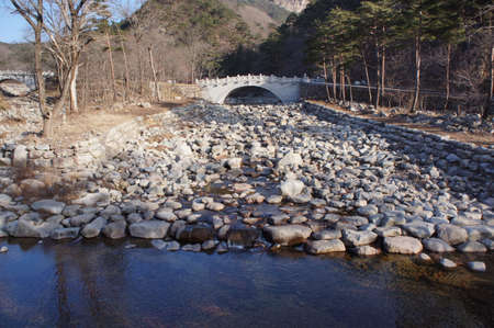 Stone bridge over the river in south korea Daegwallyeongの写真素材