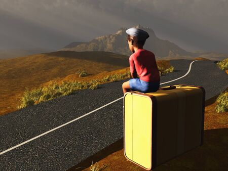 Boy sitting on a suitcase at a roadsideの写真素材