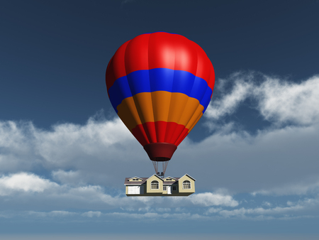 House held in the air by a balloonの写真素材