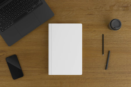 Book Cover and Phone on Wooden Tableの写真素材