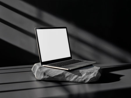 Laptop on a Stone Platform with Elegant Shadowsの写真素材