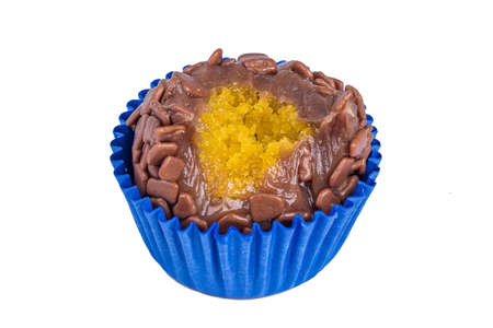 Traditional artisanal Brazilian chocolate candy, called brigadeiro, in a gourmet version filled with carrot cake. Isolated on white background.の写真素材