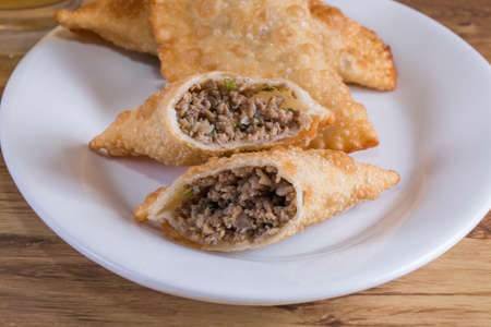 Traditional Brazilian meat-flavored pastry where it is called pastel.
